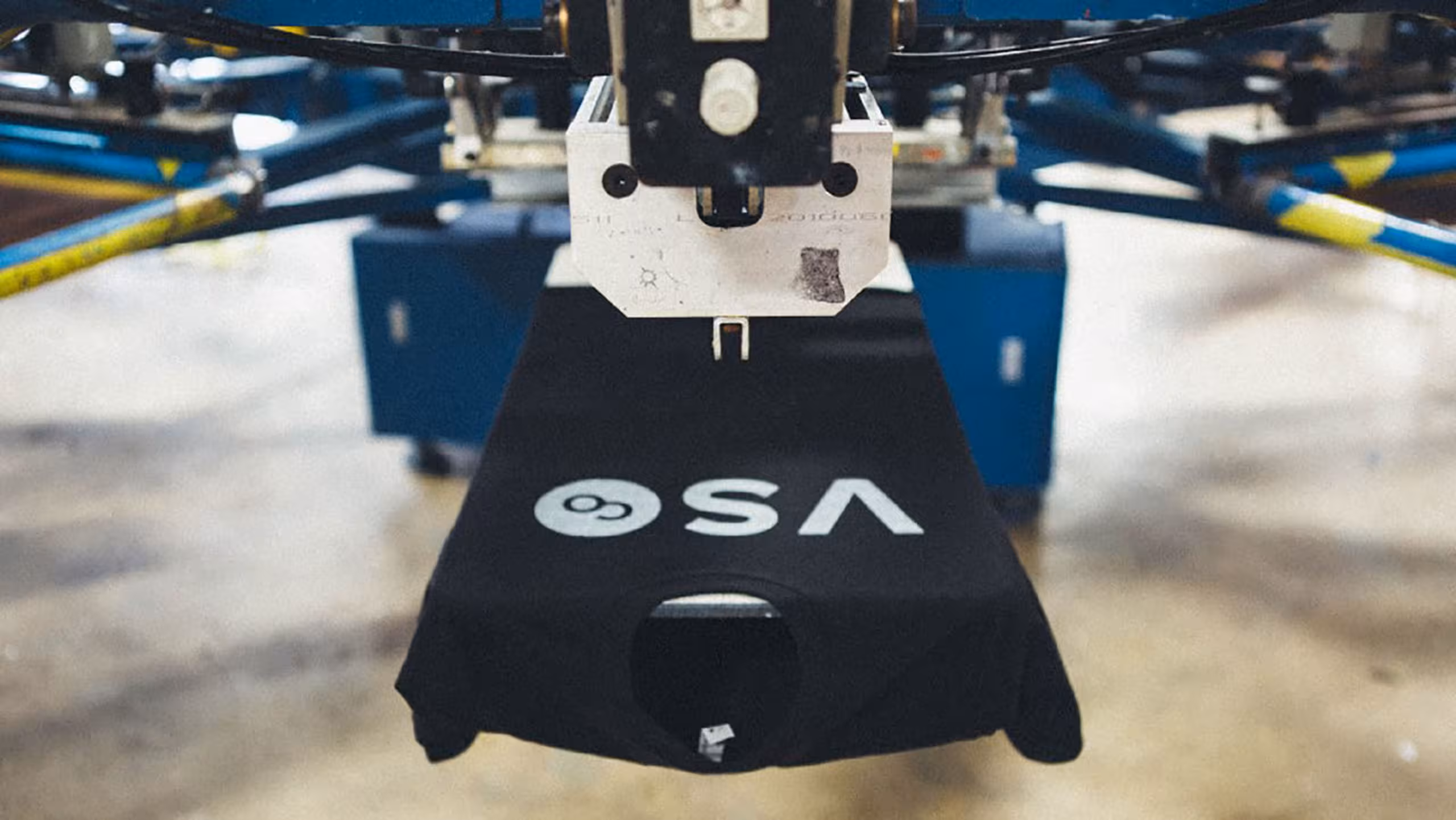 black t-shirt on screen printing press